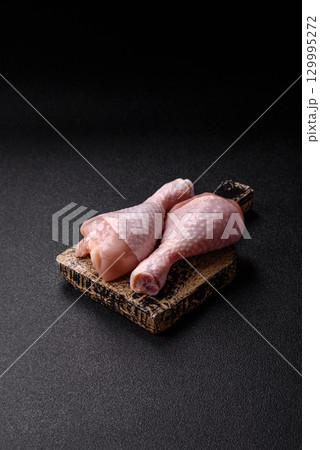 Raw chicken legs, fresh uncooked poultry meat. Chicken or turkey legs Raw chicken legs, fresh uncooked poultry meat. Chicken or turkey legs 129995272