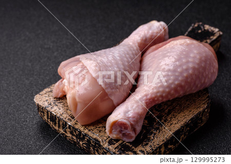 Raw chicken legs, fresh uncooked poultry meat. Chicken or turkey legs 129995273