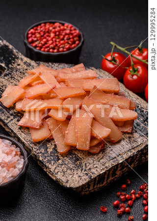 Food, dried squid in shavings or chopped as snacks or jerky. Snack dried squid for beer Food, dried squid in shavings or chopped as snacks or jerky. Snack dried squid for beer 129995284