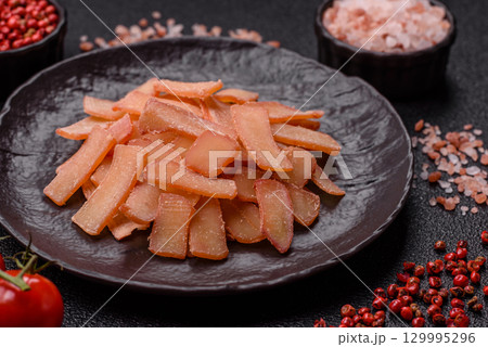 Food, dried squid in shavings or chopped as snacks or jerky. Snack dried squid for beer Food, dried squid in shavings or chopped as snacks or jerky. Snack dried squid for beer 129995296