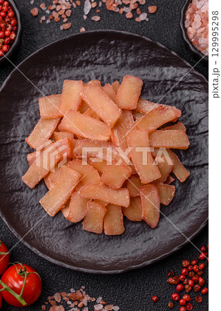 Food, dried squid in shavings or chopped as snacks or jerky. Snack dried squid for beer Food, dried squid in shavings or chopped as snacks or jerky. Snack dried squid for beer 129995298