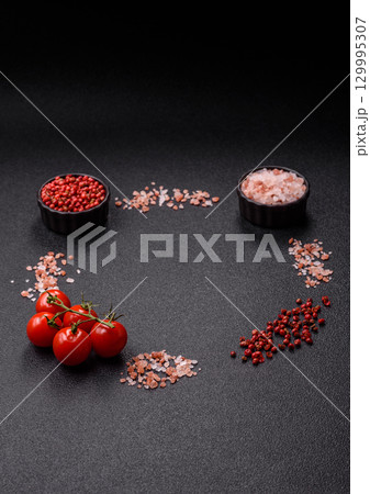 Ingredients for cooking cherry tomatoes, salt, spices and herbs Ingredients for cooking cherry tomatoes, salt, spices and herbs 129995307