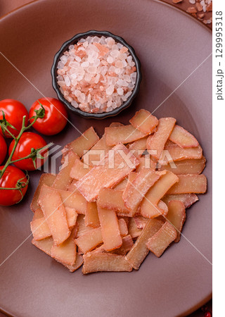 Food, dried squid in shavings or chopped as snacks or jerky. Snack dried squid for beer 129995318