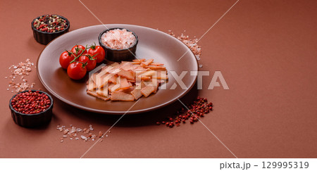 Food, dried squid in shavings or chopped as snacks or jerky. Snack dried squid for beer Food, dried squid in shavings or chopped as snacks or jerky. Snack dried squid for beer 129995319