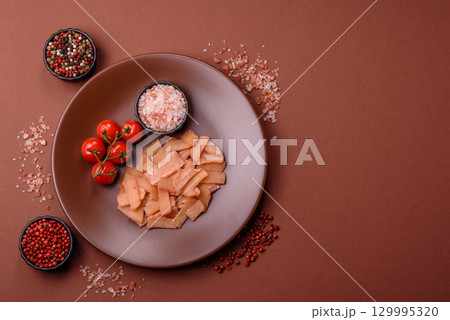 Food, dried squid in shavings or chopped as snacks or jerky. Snack dried squid for beer 129995320