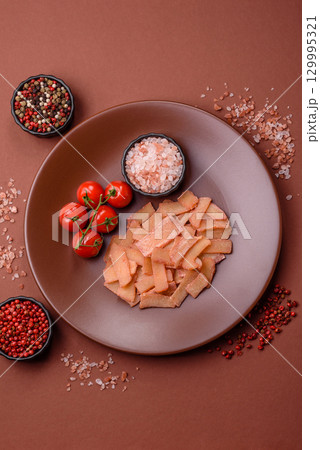 Food, dried squid in shavings or chopped as snacks or jerky. Snack dried squid for beer 129995321