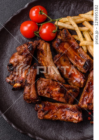 Meat, beef ribs in a marinade grilled with salt and spices. Grilled ribs 129995382