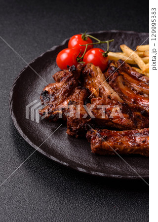 Meat, beef ribs in a marinade grilled with salt and spices. Grilled ribs 129995383