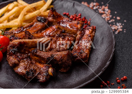 Meat, beef ribs in a marinade grilled with salt and spices. Grilled ribs 129995384