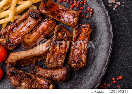 Meat, beef ribs in a marinade grilled with salt and spices. Grilled ribs 129995385
