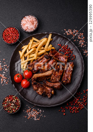 Meat, beef ribs in a marinade grilled with salt and spices. Grilled ribs 129995390