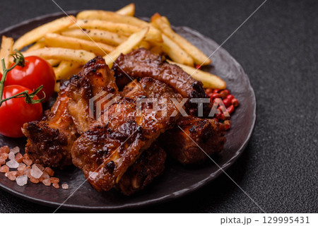 Meat, beef ribs in a marinade grilled with salt and spices. Grilled ribs 129995431