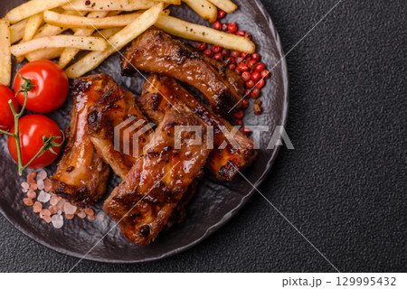 Meat, beef ribs in a marinade grilled with salt and spices. Grilled ribs 129995432