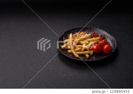 Food, French fries fried with salt and rosemary. Homemade crispy chips Food, French fries fried with salt and rosemary. Homemade crispy chips 129995455