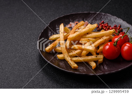 Food, French fries fried with salt and rosemary. Homemade crispy chips Food, French fries fried with salt and rosemary. Homemade crispy chips 129995459