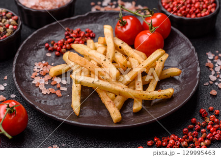 Food, French fries fried with salt and rosemary. Homemade crispy chips 129995463