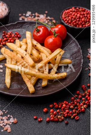 Food, French fries fried with salt and rosemary. Homemade crispy chips 129995466
