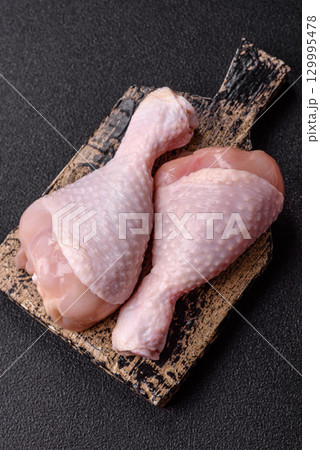 Raw chicken legs, fresh uncooked poultry meat. Chicken or turkey legs Raw chicken legs, fresh uncooked poultry meat. Chicken or turkey legs 129995478