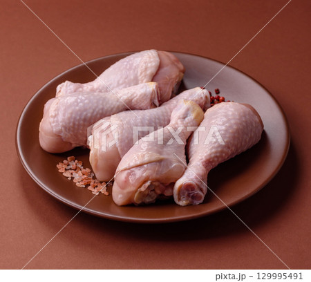Raw chicken legs, fresh uncooked poultry meat. Chicken or turkey legs Raw chicken legs, fresh uncooked poultry meat. Chicken or turkey legs 129995491