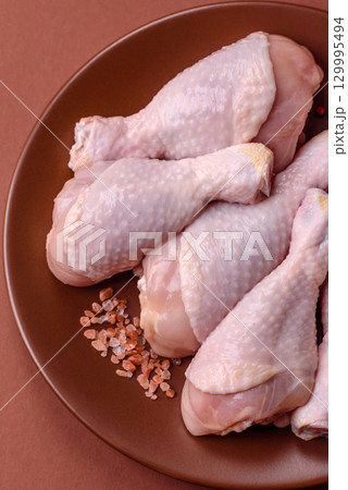 Raw chicken legs, fresh uncooked poultry meat. Chicken or turkey legs Raw chicken legs, fresh uncooked poultry meat. Chicken or turkey legs 129995494