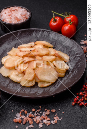 Food, dried squid in shavings or chopped as snacks or jerky. Snack dried squid for beer Food, dried squid in shavings or chopped as snacks or jerky. Snack dried squid for beer 129995509