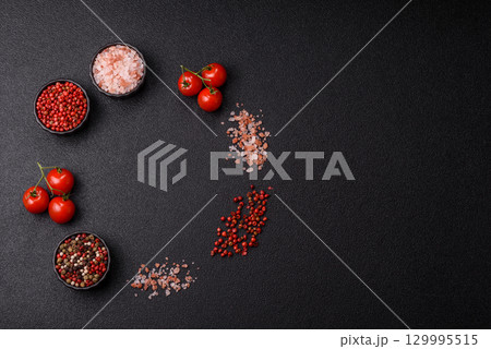 Ingredients for cooking cherry tomatoes, salt, spices and herbs Ingredients for cooking cherry tomatoes, salt, spices and herbs 129995515