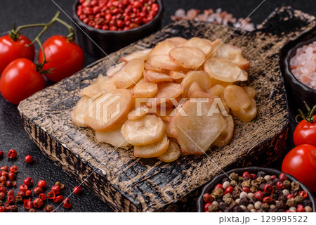Food, dried squid in shavings or chopped as snacks or jerky. Snack dried squid for beer Food, dried squid in shavings or chopped as snacks or jerky. Snack dried squid for beer 129995522