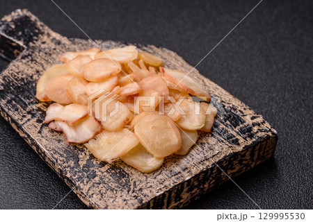 Food, dried squid in shavings or chopped as snacks or jerky. Snack dried squid for beer Food, dried squid in shavings or chopped as snacks or jerky. Snack dried squid for beer 129995530