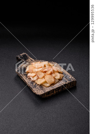 Food, dried squid in shavings or chopped as snacks or jerky. Snack dried squid for beer Food, dried squid in shavings or chopped as snacks or jerky. Snack dried squid for beer 129995536