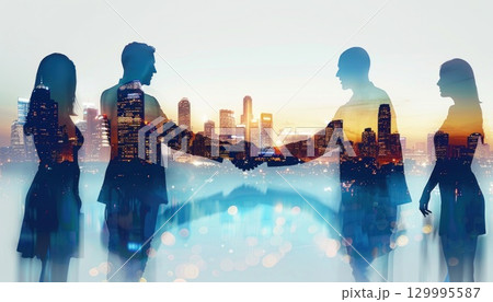 Happy group shaking hands near water with city skyline in background Happy group shaking hands near water with city skyline in background 129995587
