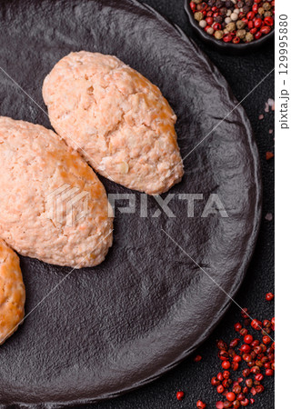 Steamed fish or chicken cutlets or meatballs with salt and spices. Fish cutlets 129995880