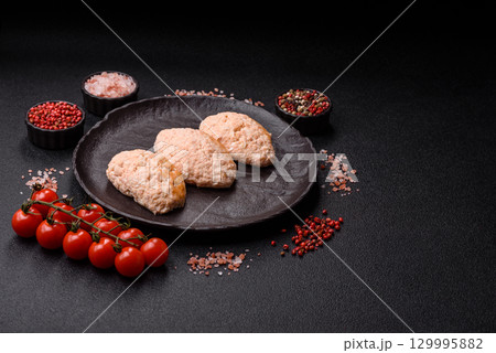 Steamed fish or chicken cutlets or meatballs with salt and spices. Fish cutlets 129995882