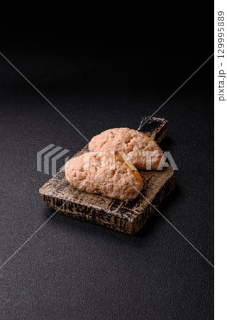 Steamed fish or chicken cutlets or meatballs with salt and spices. Fish cutlets 129995889