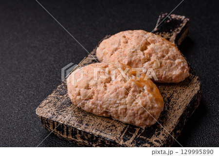 Steamed fish or chicken cutlets or meatballs with salt and spices. Fish cutlets 129995890