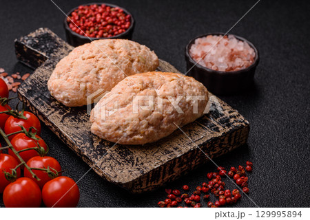 Steamed fish or chicken cutlets or meatballs with salt and spices. Fish cutlets 129995894