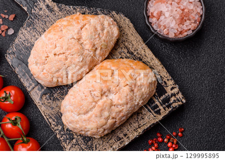 Steamed fish or chicken cutlets or meatballs with salt and spices. Fish cutlets 129995895