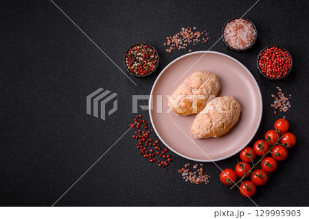 Steamed fish or chicken cutlets or meatballs with salt and spices. Fish cutlets 129995903