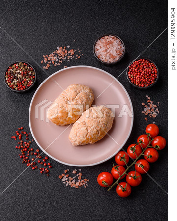 Steamed fish or chicken cutlets or meatballs with salt and spices. Fish cutlets 129995904