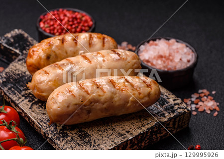 Grilled chicken or beef sausages, a hot meat dish. Barbecued sausages Grilled chicken or beef sausages, a hot meat dish. Barbecued sausages 129995926