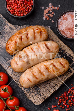 Grilled chicken or beef sausages, a hot meat dish. Barbecued sausages Grilled chicken or beef sausages, a hot meat dish. Barbecued sausages 129995928