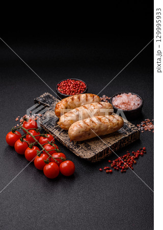 Grilled chicken or beef sausages, a hot meat dish. Barbecued sausages 129995933