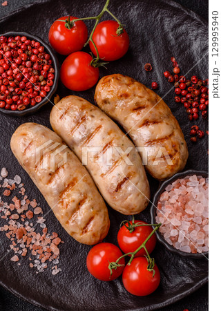 Grilled chicken or beef sausages, a hot meat dish. Barbecued sausages 129995940