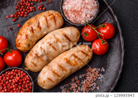 Grilled chicken or beef sausages, a hot meat dish. Barbecued sausages Grilled chicken or beef sausages, a hot meat dish. Barbecued sausages 129995943