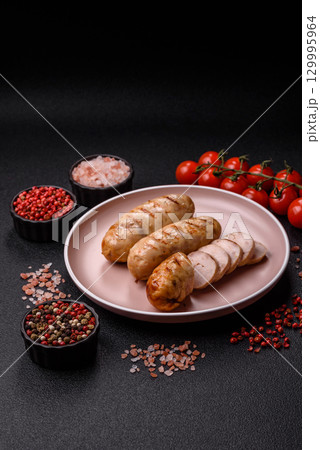 Grilled chicken or beef sausages, a hot meat dish. Barbecued sausages Grilled chicken or beef sausages, a hot meat dish. Barbecued sausages 129995964