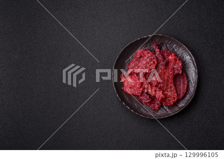 Jerky or dried chicken and cherry snacks. Dehydrated, dried snacks for beer 129996105