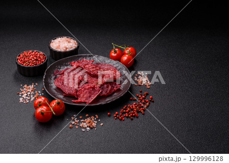 Jerky or dried chicken and cherry snacks. Dehydrated, dried snacks for beer 129996128