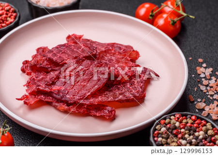 Jerky or dried chicken and cherry snacks. Dehydrated, dried snacks for beer Jerky or dried chicken and cherry snacks. Dehydrated, dried snacks for beer 129996153