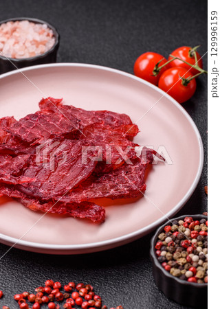 Jerky or dried chicken and cherry snacks. Dehydrated, dried snacks for beer Jerky or dried chicken and cherry snacks. Dehydrated, dried snacks for beer 129996159