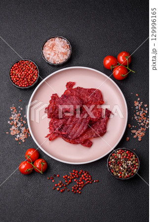 Jerky or dried chicken and cherry snacks. Dehydrated, dried snacks for beer Jerky or dried chicken and cherry snacks. Dehydrated, dried snacks for beer 129996165