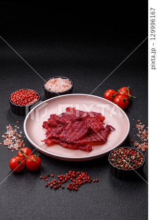 Jerky or dried chicken and cherry snacks. Dehydrated, dried snacks for beer Jerky or dried chicken and cherry snacks. Dehydrated, dried snacks for beer 129996167